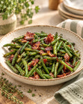 Terri's green beans with crispy bacon in a speckled ceramic bowl